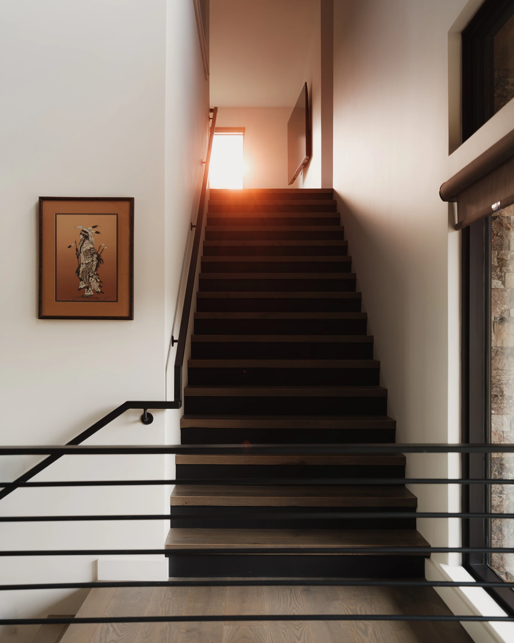 Stairwell lit by golden-hour light — architectural photography Big Sky Montana, Speedwell Cabin